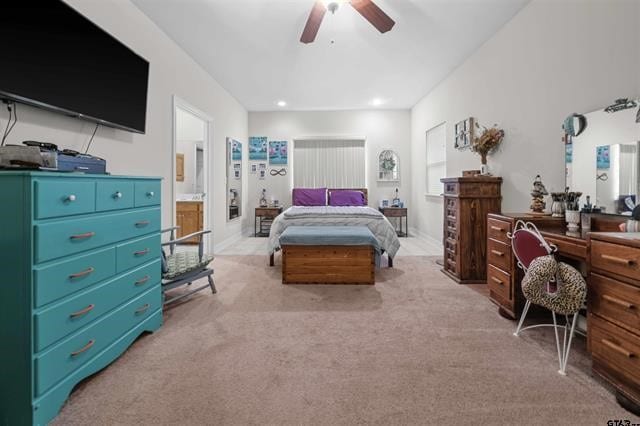 bedroom featuring ceiling fan and light carpet