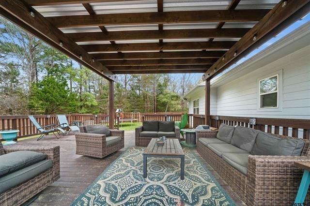 wooden deck with an outdoor living space