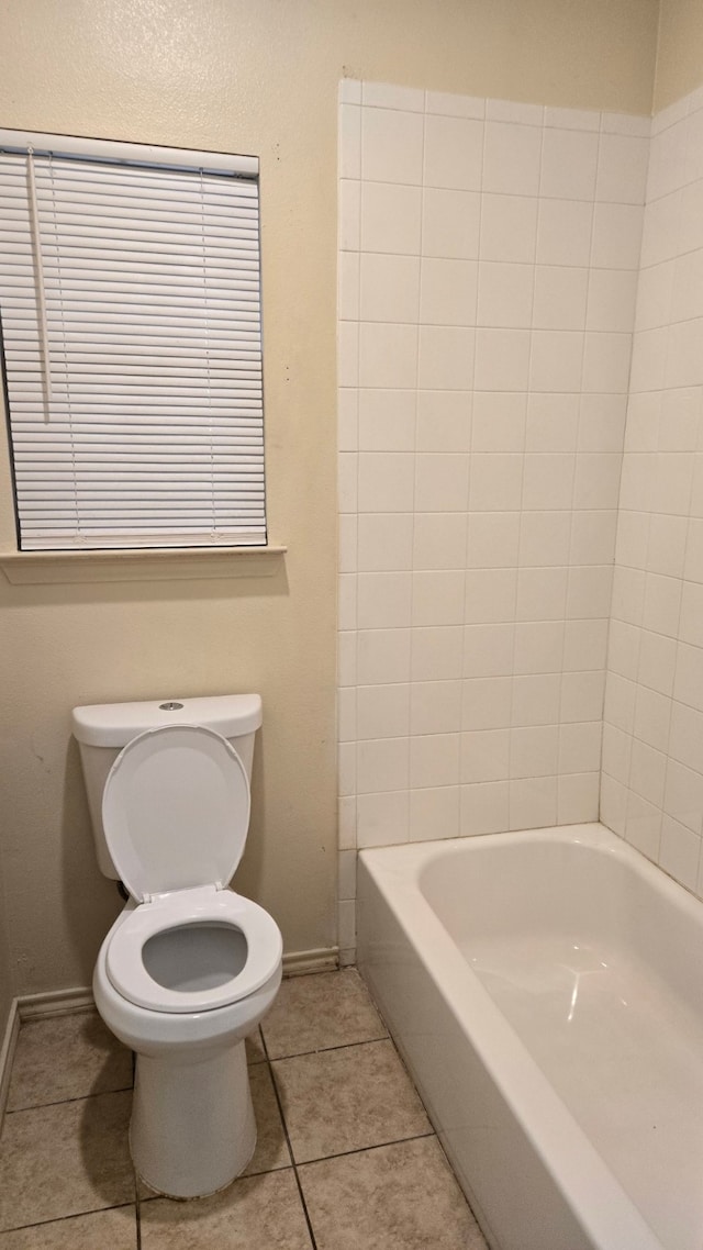 bathroom featuring tile patterned flooring and toilet