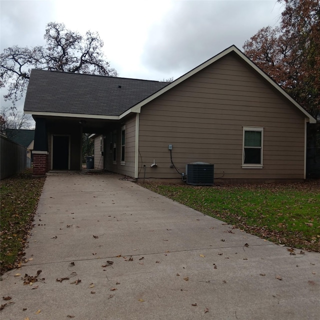 view of side of property with central AC unit