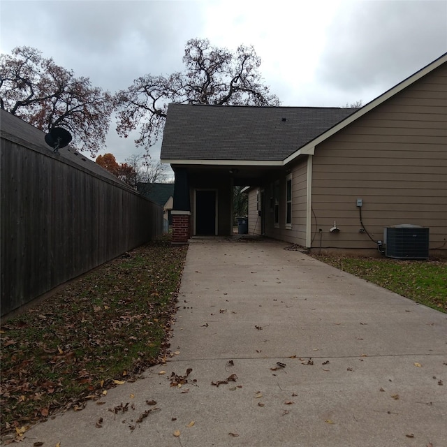 view of side of property with cooling unit