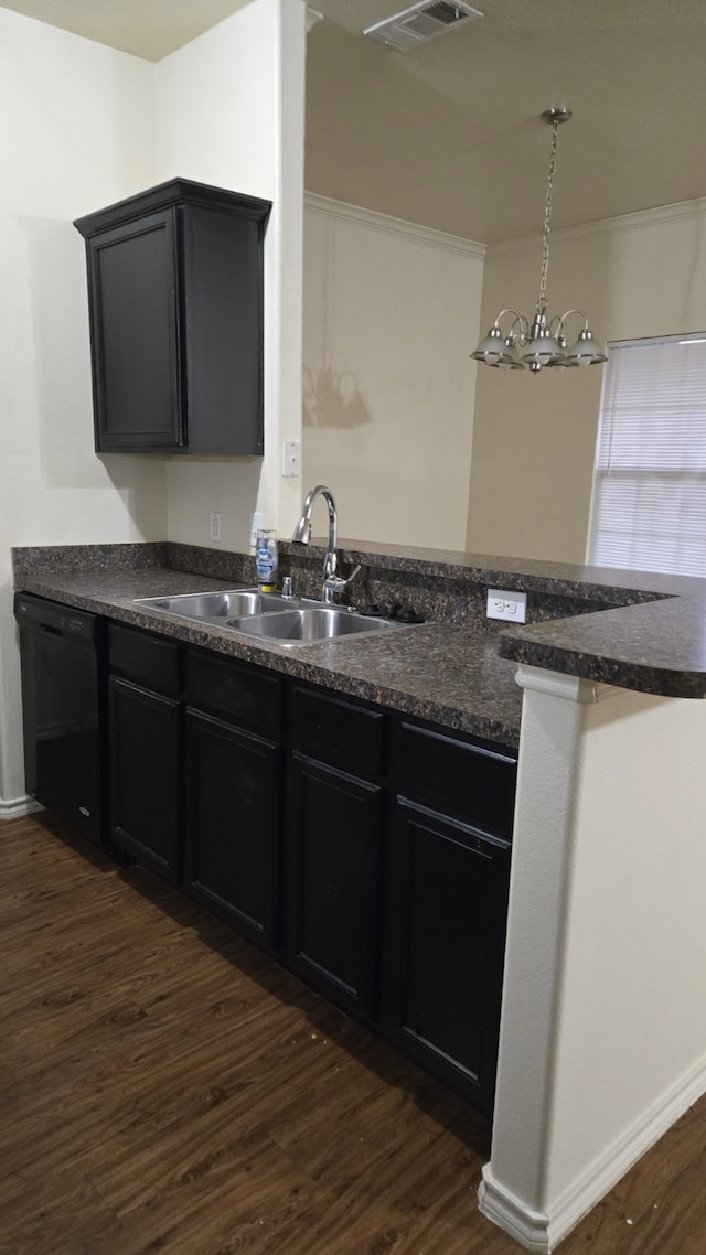 kitchen featuring dark wood-type flooring, sink, an inviting chandelier, black dishwasher, and hanging light fixtures