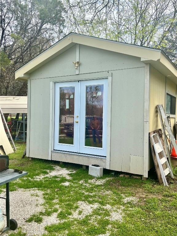 view of shed / structure featuring a yard