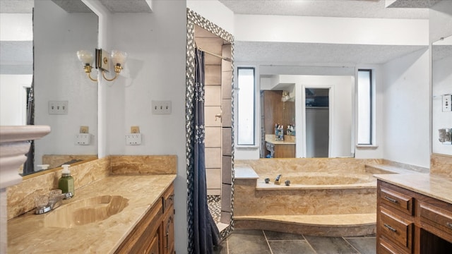 bathroom with vanity, tile flooring, a textured ceiling, and shower with separate bathtub