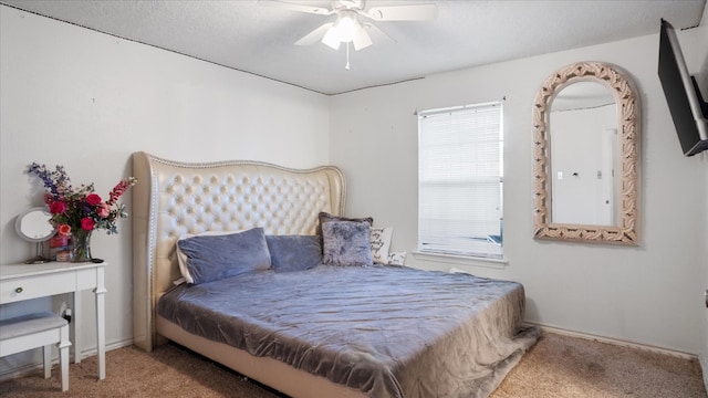 bedroom with ceiling fan, multiple windows, and carpet