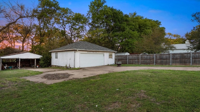 garage at dusk with a lawn