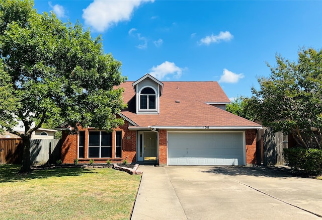 view of property with a front yard and a garage