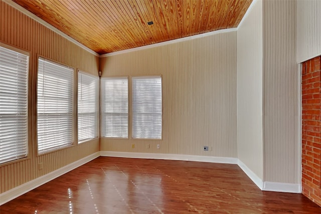 unfurnished room featuring crown molding, wood ceiling, and hardwood / wood-style floors