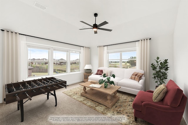 living room with ceiling fan, plenty of natural light, and carpet