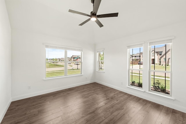 unfurnished room with dark hardwood / wood-style flooring and ceiling fan