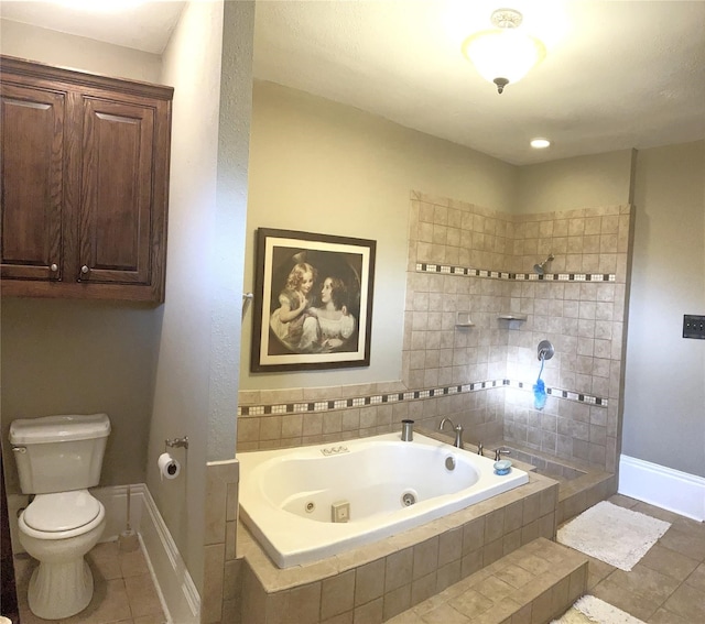 bathroom featuring toilet, tile flooring, and tiled bath