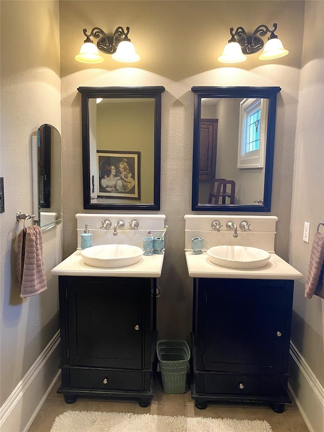 bathroom featuring dual bowl vanity and tile flooring