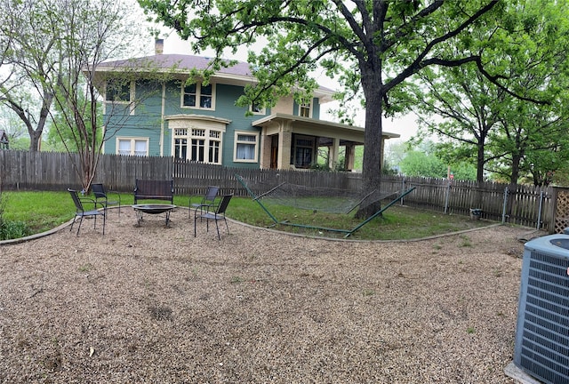 exterior space featuring central AC and an outdoor fire pit