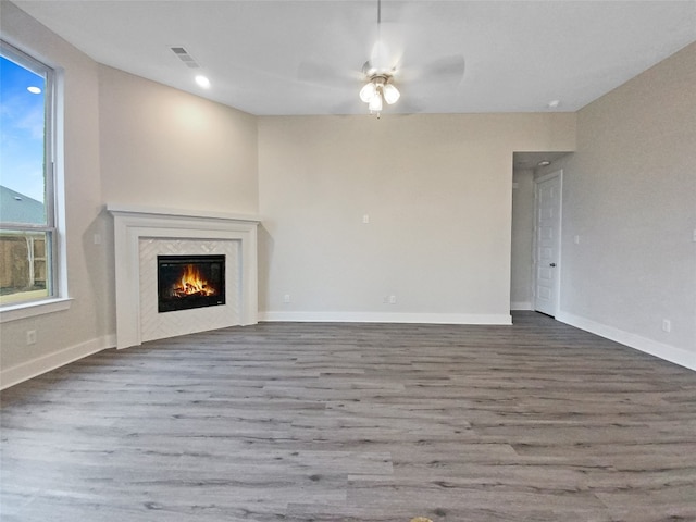 unfurnished living room with ceiling fan and light wood-type flooring