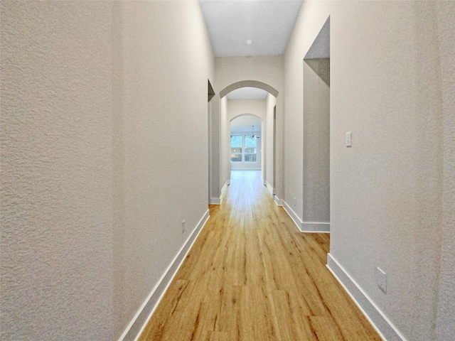 corridor featuring light hardwood / wood-style floors