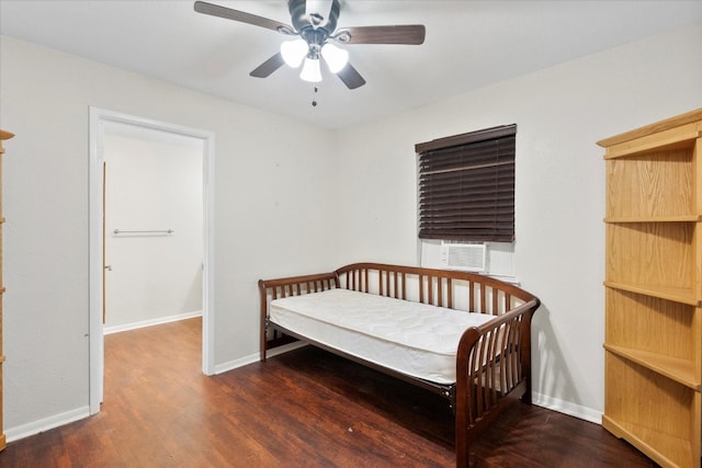 bedroom with cooling unit and ceiling fan