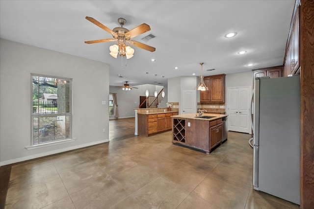 carpeted spare room featuring ceiling fan and plenty of natural light