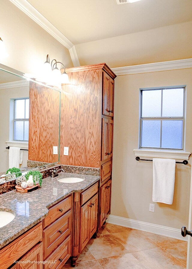 bathroom featuring vanity and ornamental molding