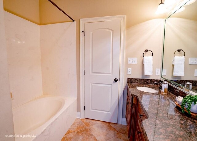 bathroom with tile patterned flooring and vanity