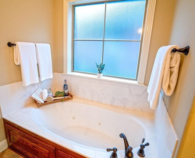 bathroom featuring a tub to relax in