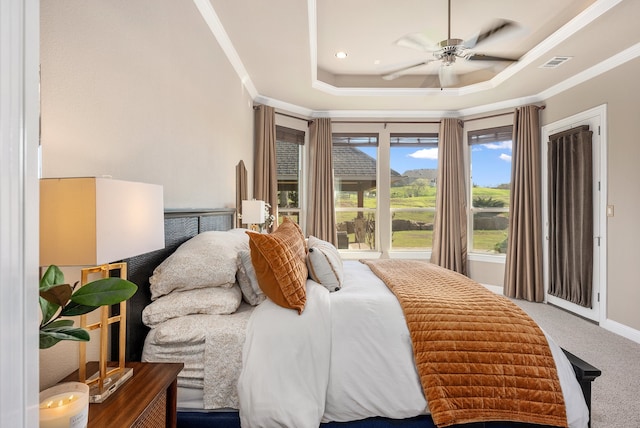 bedroom with carpet, ceiling fan, a raised ceiling, and crown molding