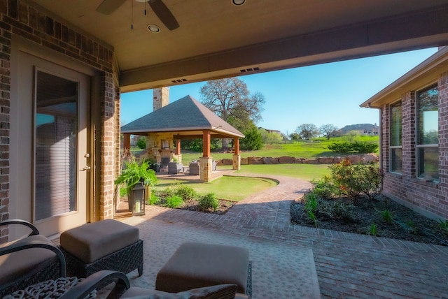 view of patio with a gazebo and ceiling fan