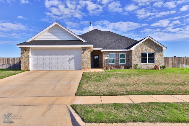 ranch-style house featuring a front yard and a garage