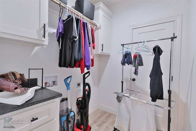 mudroom with light hardwood / wood-style floors