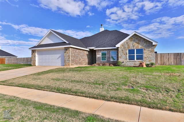 view of front of house featuring a front yard and a garage