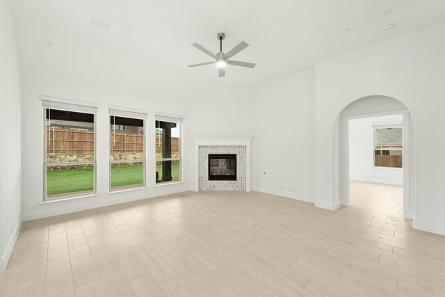 unfurnished living room featuring ceiling fan