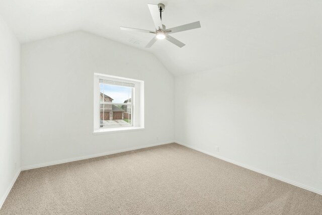 additional living space featuring lofted ceiling, carpet floors, and ceiling fan