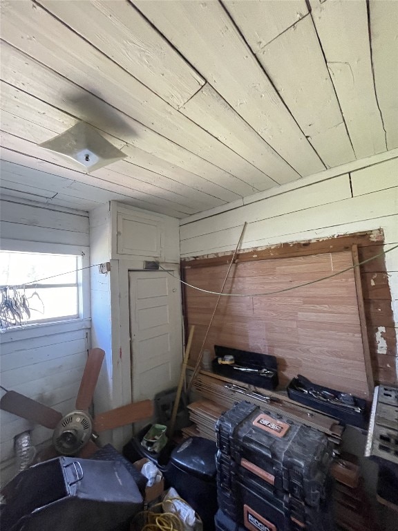 miscellaneous room with wood walls