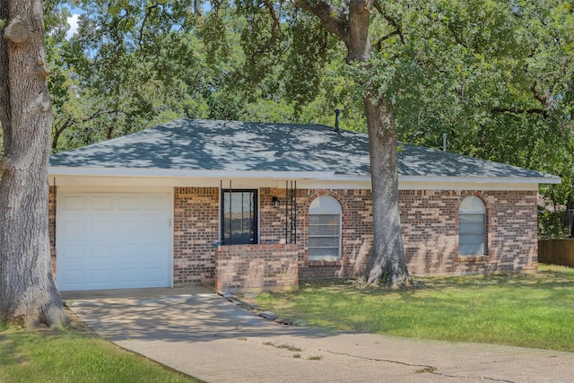 ranch-style house with a garage and a front yard