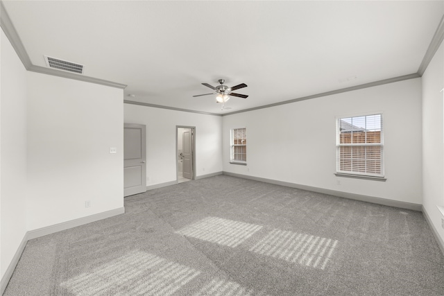 carpeted spare room featuring ornamental molding and ceiling fan