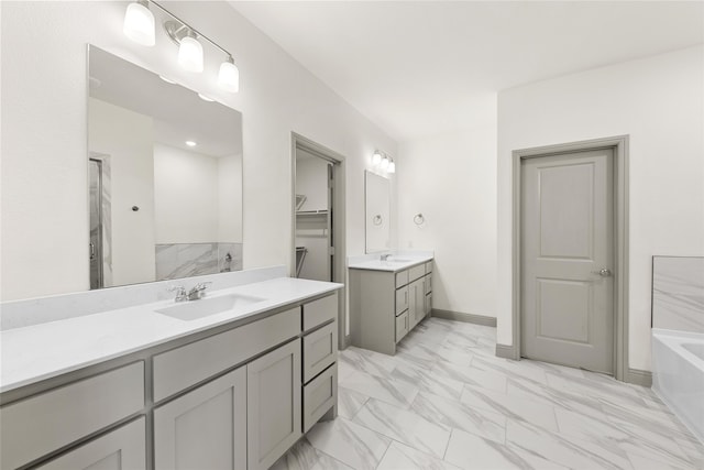 bathroom with vanity and a bathing tub