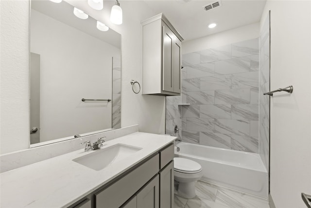 full bathroom with vanity, toilet, and tiled shower / bath