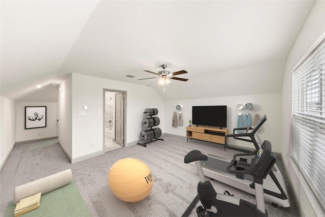 workout room featuring ceiling fan, carpet floors, and vaulted ceiling