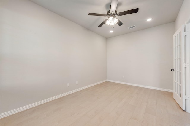 spare room featuring light hardwood / wood-style flooring and ceiling fan