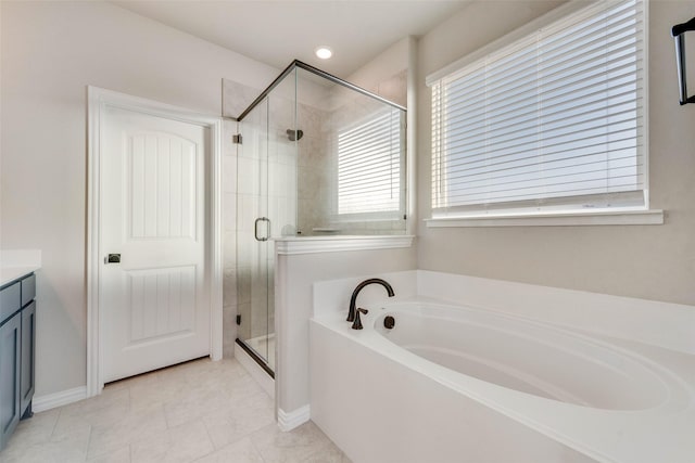 bathroom with vanity, tile patterned floors, and independent shower and bath