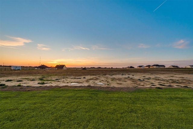 view of yard at dusk