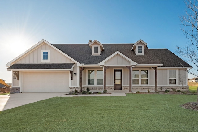 craftsman inspired home with a front yard and a garage