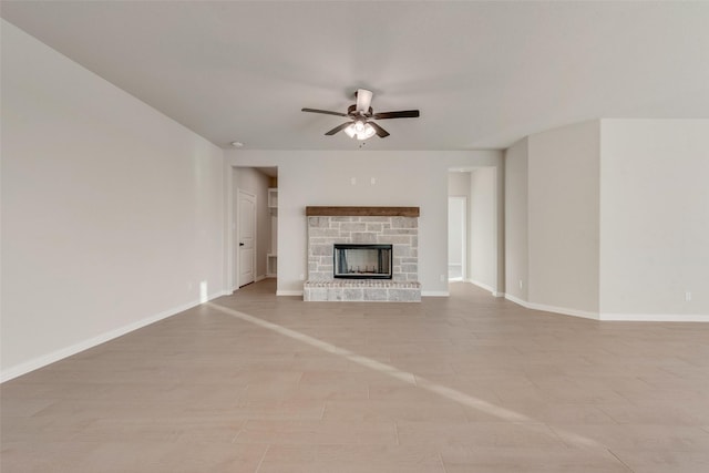 unfurnished living room featuring a fireplace and ceiling fan