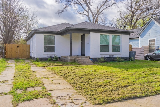 bungalow-style home featuring a front yard