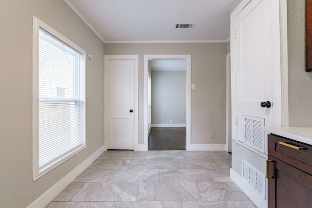 bathroom with ornamental molding and tile flooring