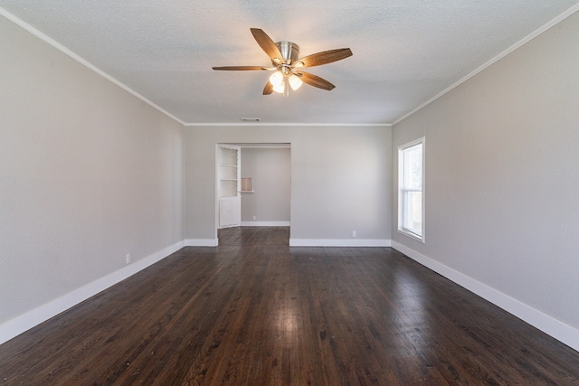 spare room with dark hardwood / wood-style flooring, ceiling fan, a textured ceiling, and crown molding