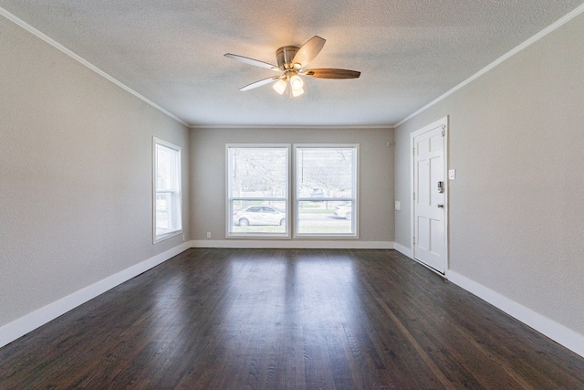 empty room with dark hardwood / wood-style flooring, ceiling fan, a textured ceiling, and crown molding