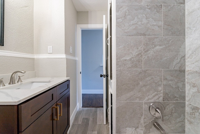 bathroom featuring hardwood / wood-style floors and vanity