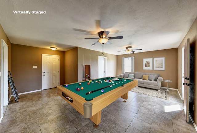 game room featuring baseboards, a ceiling fan, billiards, and a textured ceiling
