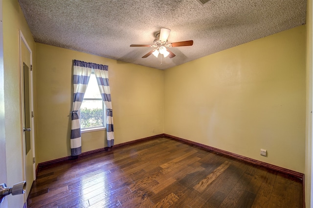 unfurnished room featuring ceiling fan, dark wood-type flooring, and a textured ceiling