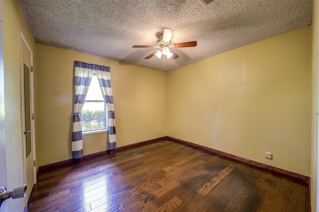 spare room with a textured ceiling, ceiling fan, hardwood / wood-style flooring, and baseboards